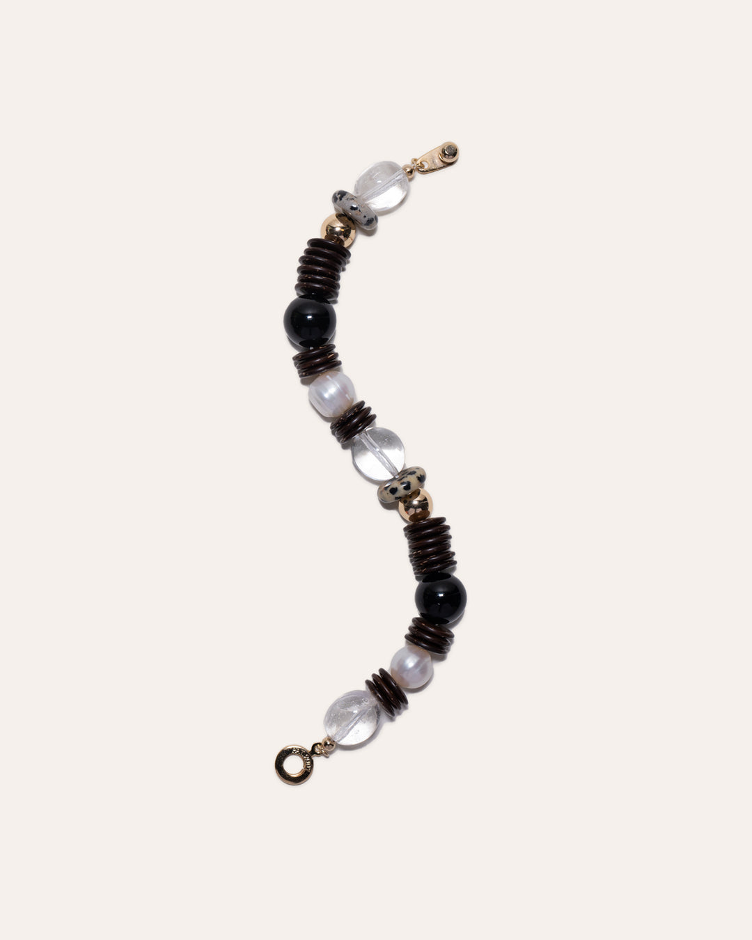 Earth Mix bracelet featuring coconut disc beads, clear quartz, dalmatian jasper, black onyx, and gold beads.