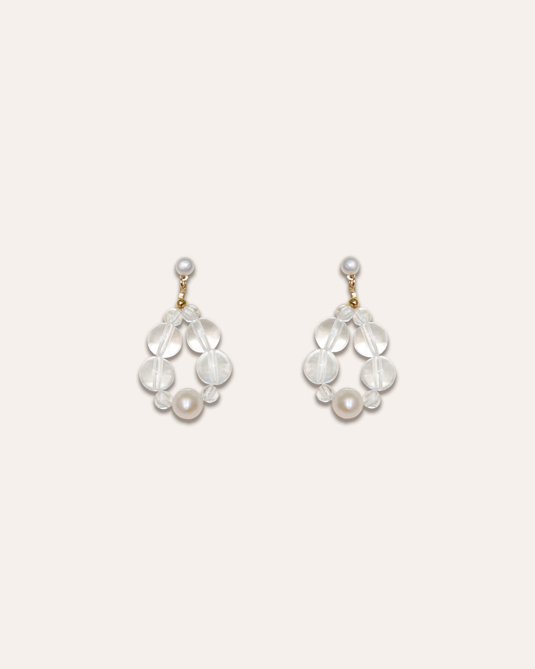 Studio shot of the Eterna Nova earrings in Freshwater pearl and clear quartz.