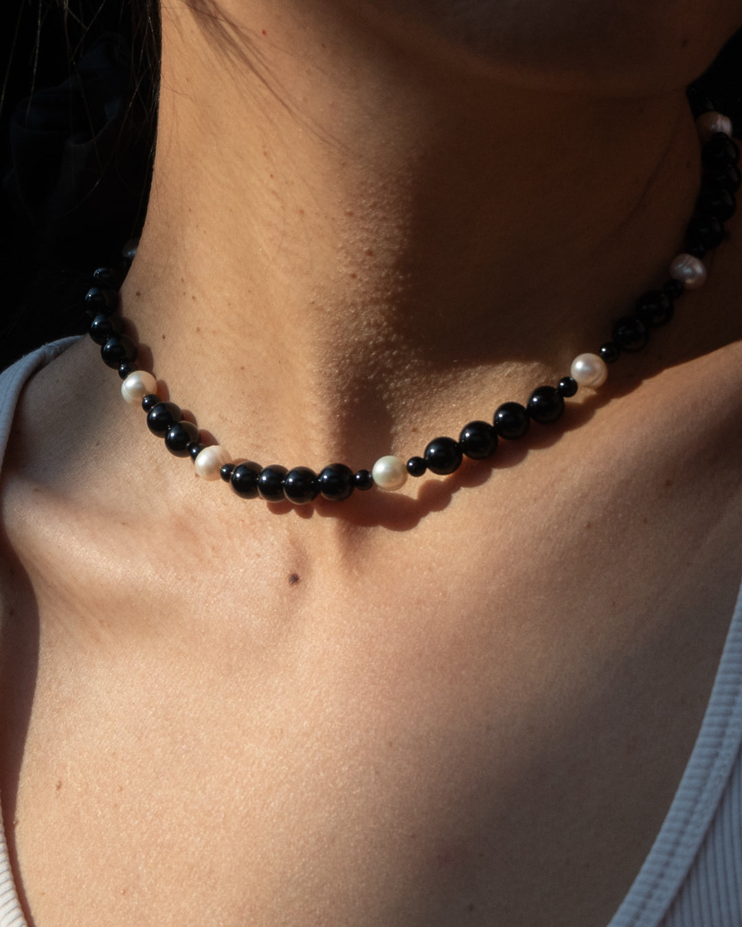 Eterna Nova Necklace, a striking combination of freshwater pearls and onyx beads.