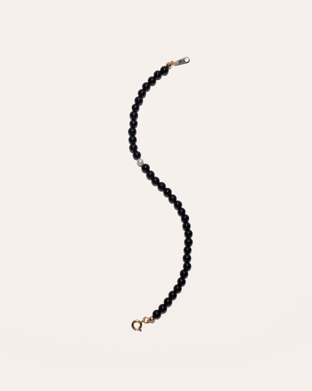 Gem & One bracelet featuring black onyx and freshwater pearl beads.