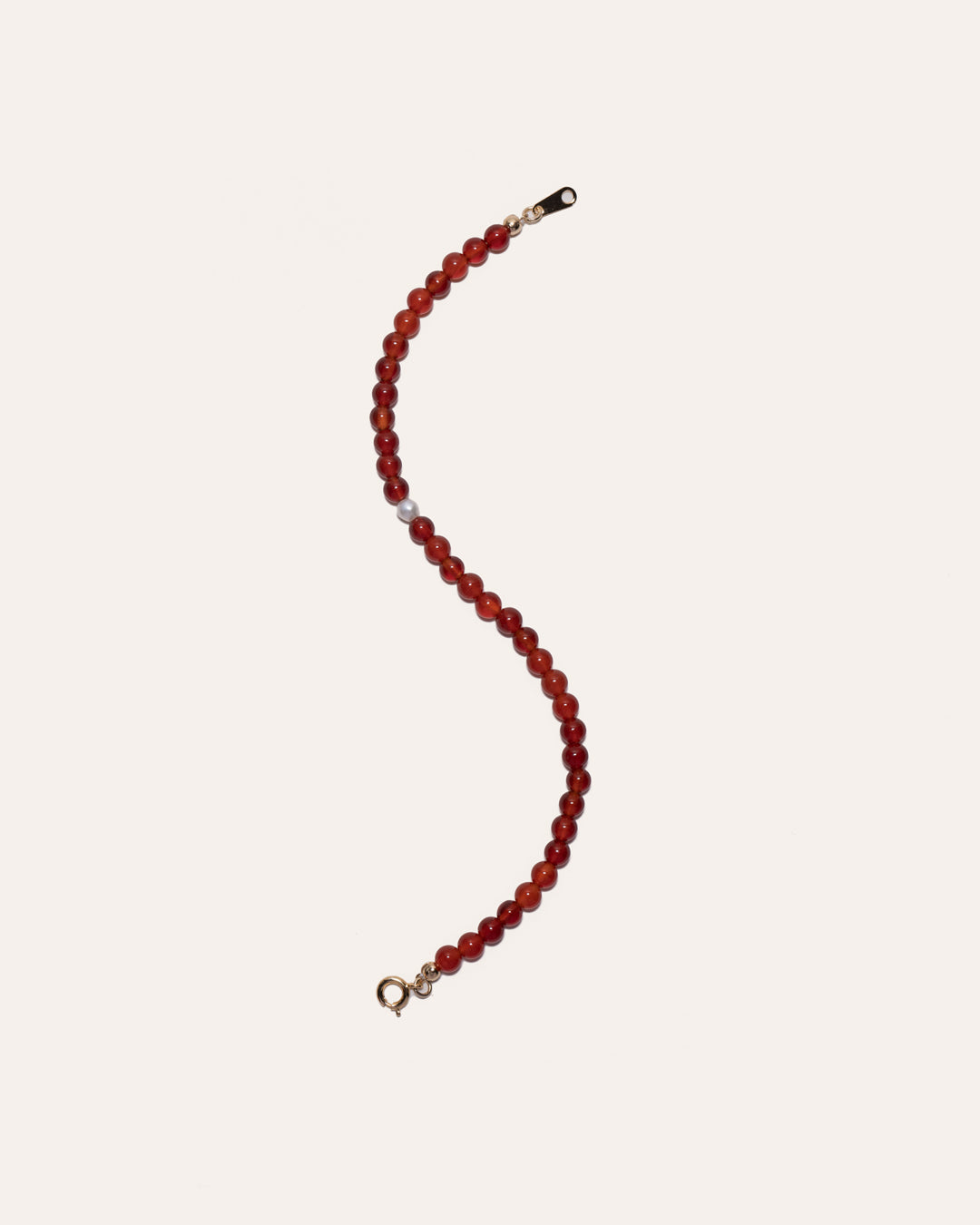 Gem & One bracelet featuring red agate and freshwater pearl beads.