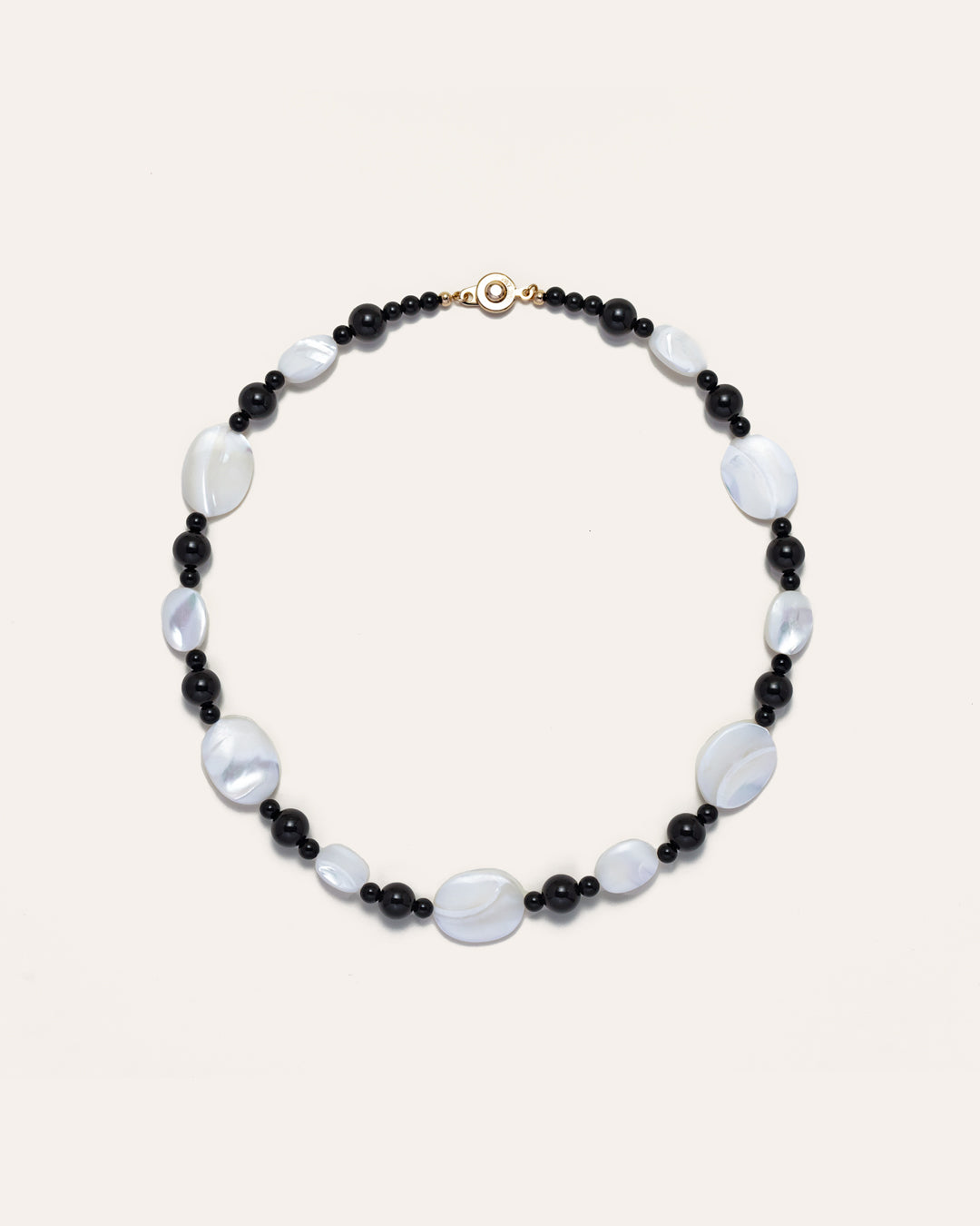 Sonata Moonlit Onyx necklace features mother of pearl (MOP) and onyx stones, creating an elegant piece of accessories.