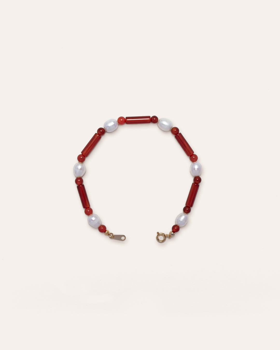 Starry Bracelet Red Agate featuring red agate and freshwater pearl, showcasing a delicate blend of natural stone and lustrous pearl on a wire bracelet. This handmade accessory is both stylish and unique, perfect for casual wear or as a statement piece.