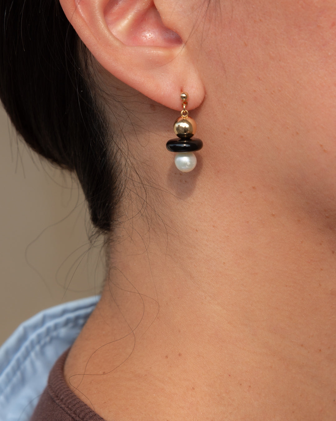 Stella earrings, featuring 14k gold vermeil balls, black onyx and freshwater pearl.