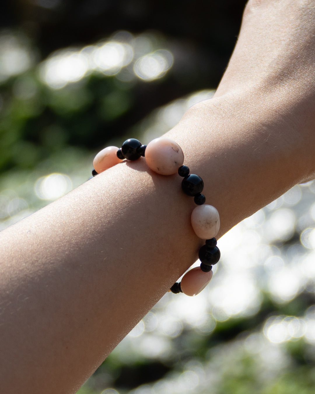 Sonata Blush bracelet with pink opal and onyx beads, featuring a mix of colors and styles, showcasing its elegance and versatility for fashion accessory.