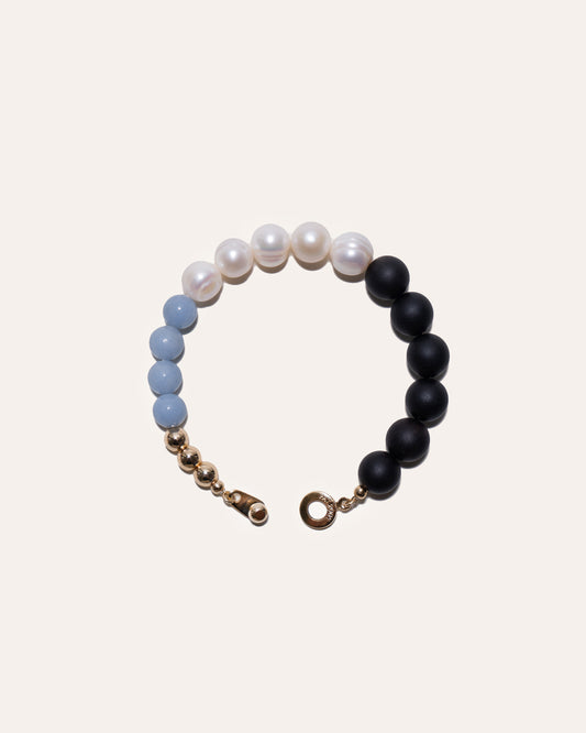 Drift West bracelet with gold beads, angelite, freshwater pearls, wooden beads.
