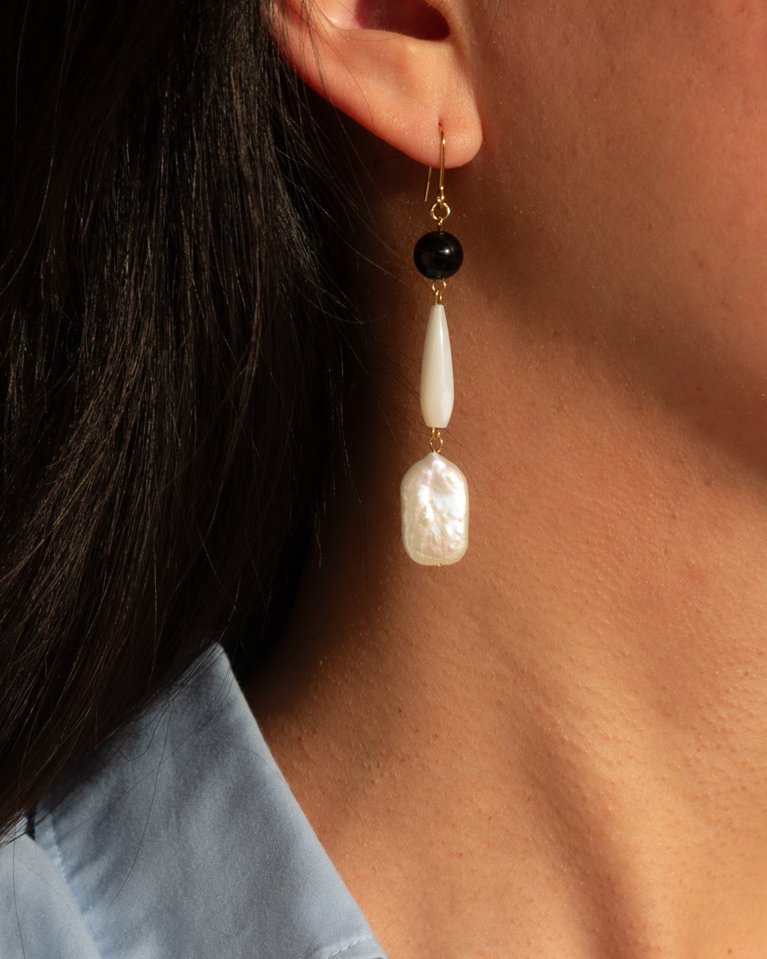 Freshwater pearl earrings with onyx and MOP, designed for everyday wear, showcasing elegance and sophistication of the Furin Earrings. 