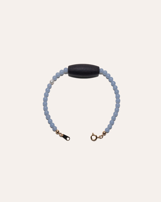 Gem & One Rooted bracelet with oval dark rosewood bead, angelite, and freshwater pearl.
