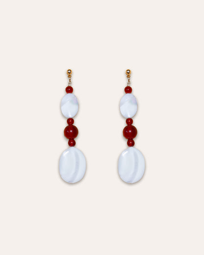Studio shot of Moonlit Earrings in Red Agate and Mother of Pearl.