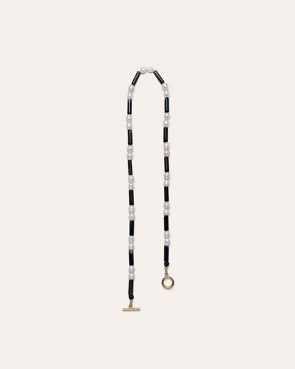 Rhythm necklace in black and white, featuring a freshwater pearls and onyx beads, showcasing elegant jewelry craftsmanship. 