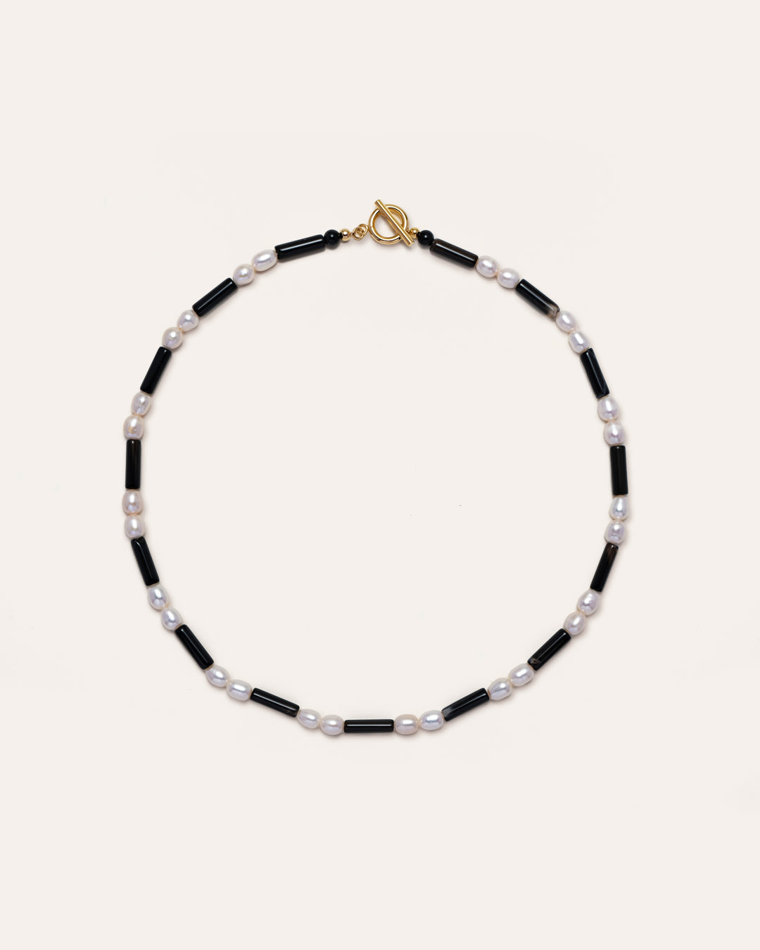 Rhythm Onyx Necklace featuring Freshwater Pearls and onyx beads, a stylish accessory for everyday wear, perfect for fashion enthusiasts and those seeking elegance in simplicity. 