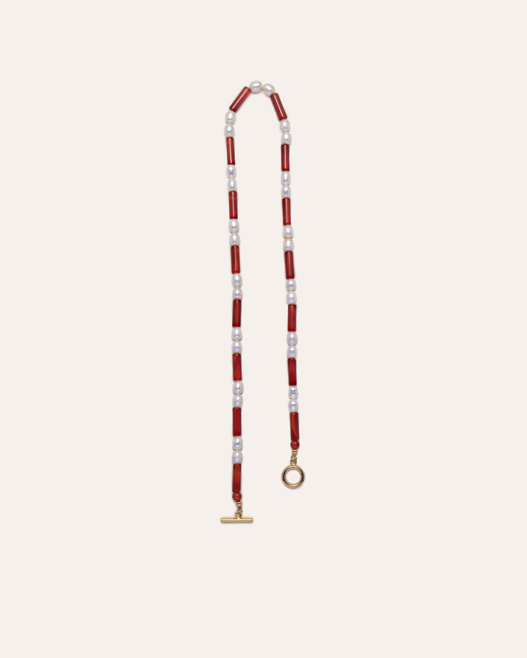 Rhythm necklace with striking red agates and freshwater pearls, exuding elegance and sophistication. 