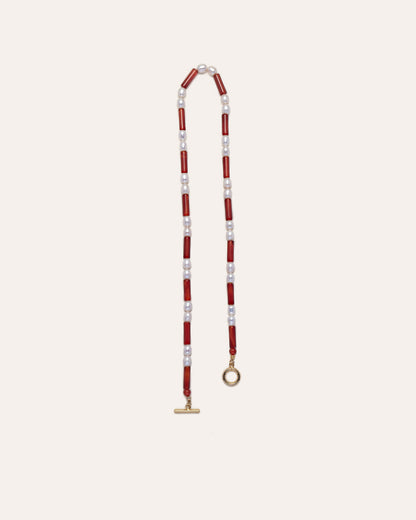 Rhythm necklace with striking red agates and freshwater pearls, exuding elegance and sophistication. 