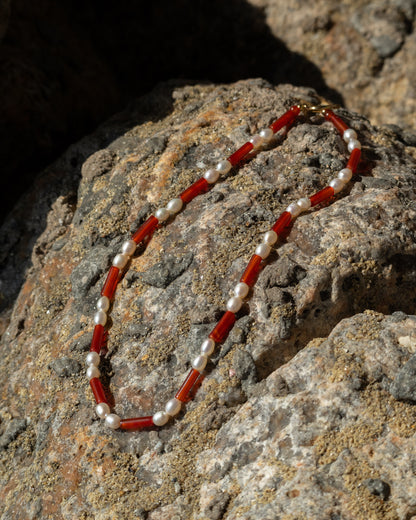 A freshwater pearl and red agate Rhythm Necklace, a stylish accessory for jewelry enthusiasts. 