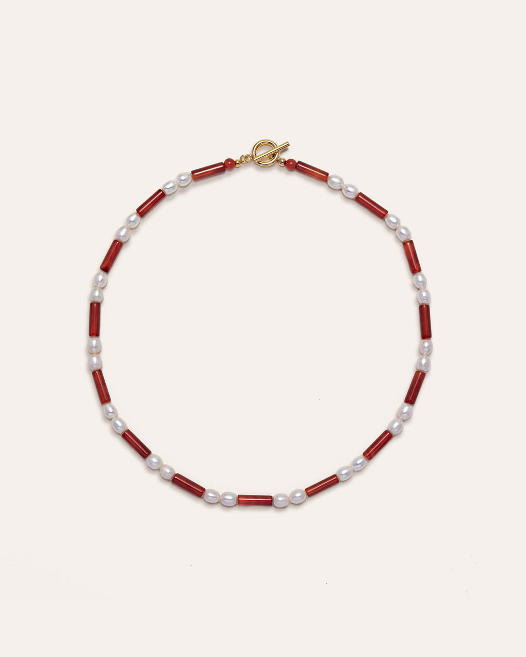 Red and gold freshwater pearl necklace, Rhythm, features red agate beads for a unique fashion accessory. 