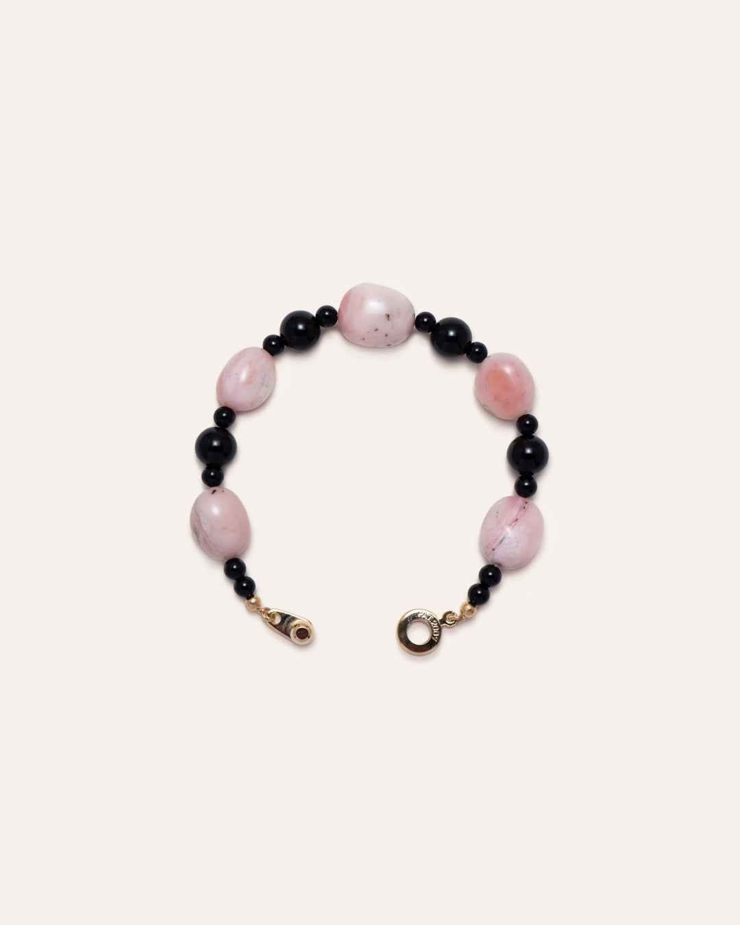 Sonata Blush bracelet a bracelet featuring delicate pink opal stones and onyx accents, crafted for style and elegance. 