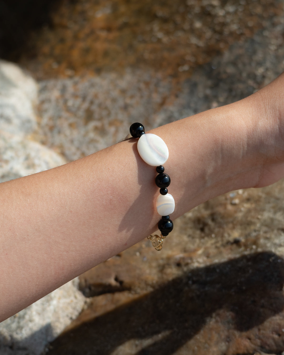 Sonata Moonlit Onyx Bracelet: A bracelet of onyx and mother of pearl, symbolizing tranquility and wisdom. 