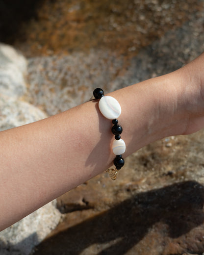 Sonata Moonlit Onyx Bracelet: A bracelet of onyx and mother of pearl, symbolizing tranquility and wisdom. 